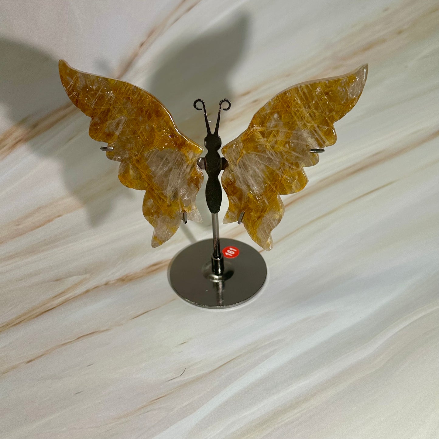 Golden healer vlinders op standaard