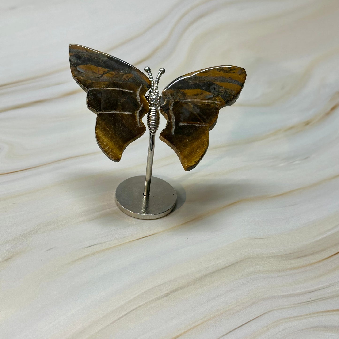 Kleine vlinder op standaard zilver