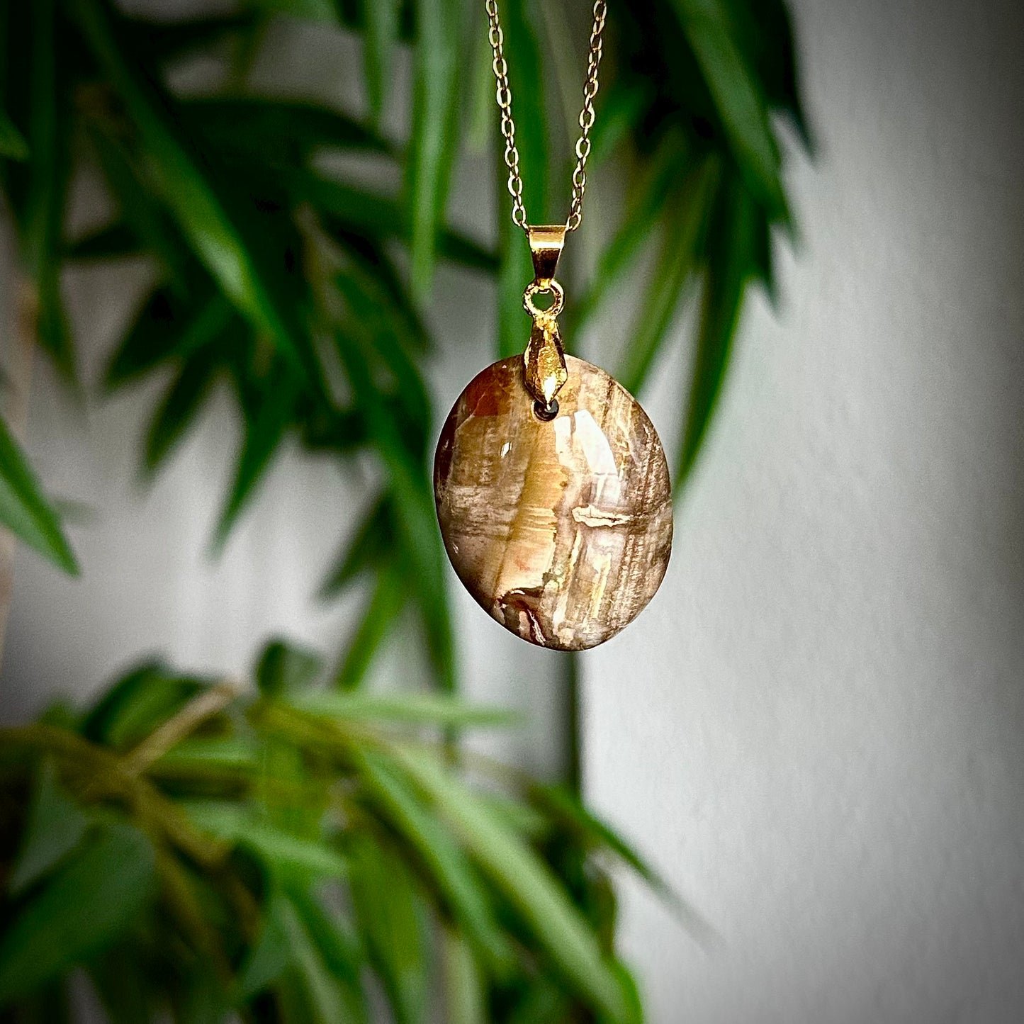 Versteend hout kettinghangers - goud